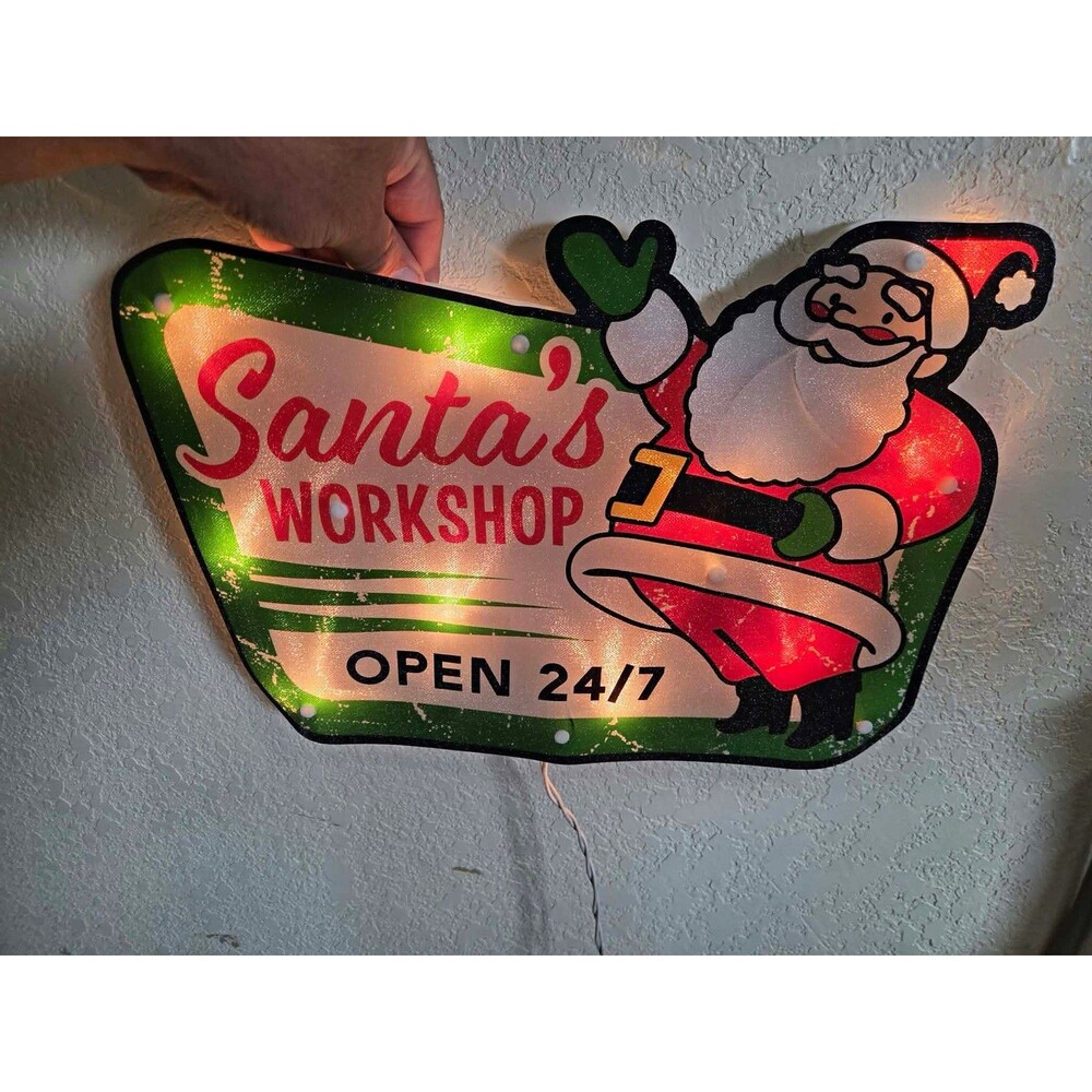 Santa's Workshop Open 24/7" retro-style lighted holiday sign